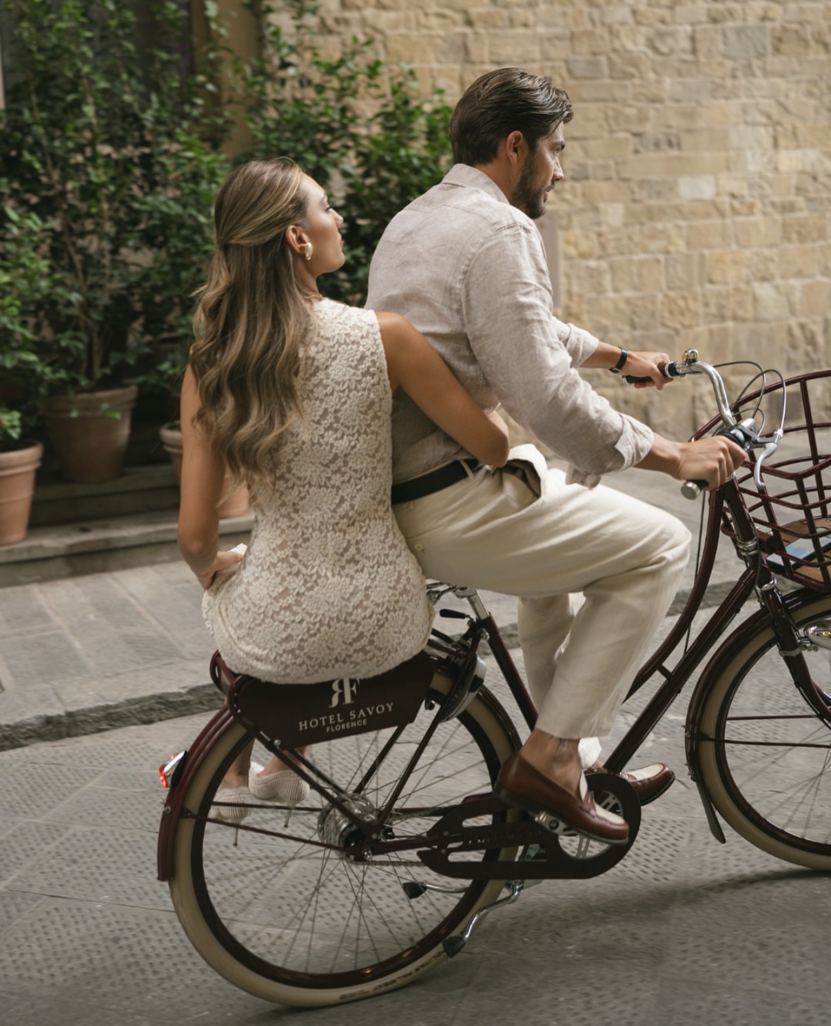 Hotel Savoy Firenze guests riding a custom Velorbis bicycle through Florence